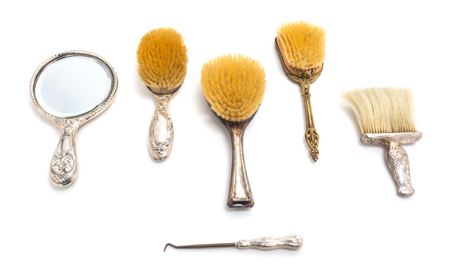 An American Silver Dressing Set, Gorham Mfg. Co., Providence, RI, comprising a brush, a hand mirror, a powder brush and a button hook,