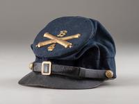 [CIVIL WAR]. McDowell-style forage cap with 4th regimental number and artillery insignia.