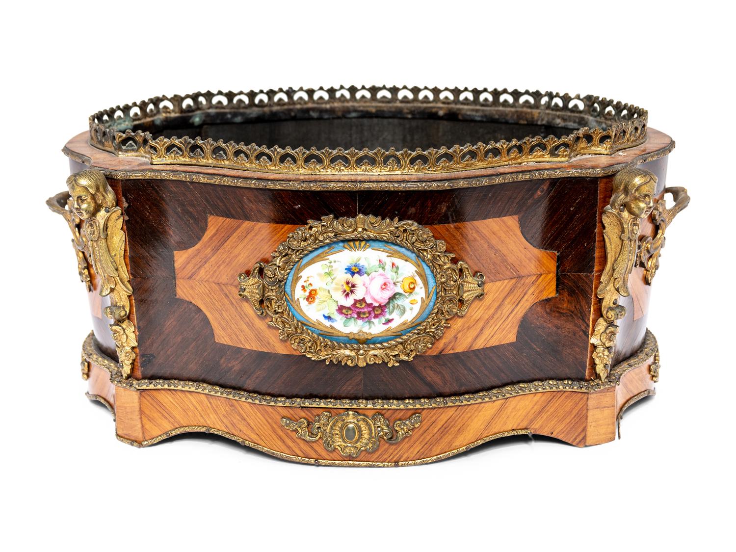 A French Porcelain and Gilt Bronze Mounted Kingwood Jardinière
