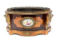 A French Porcelain and Gilt Bronze Mounted Kingwood Jardinière