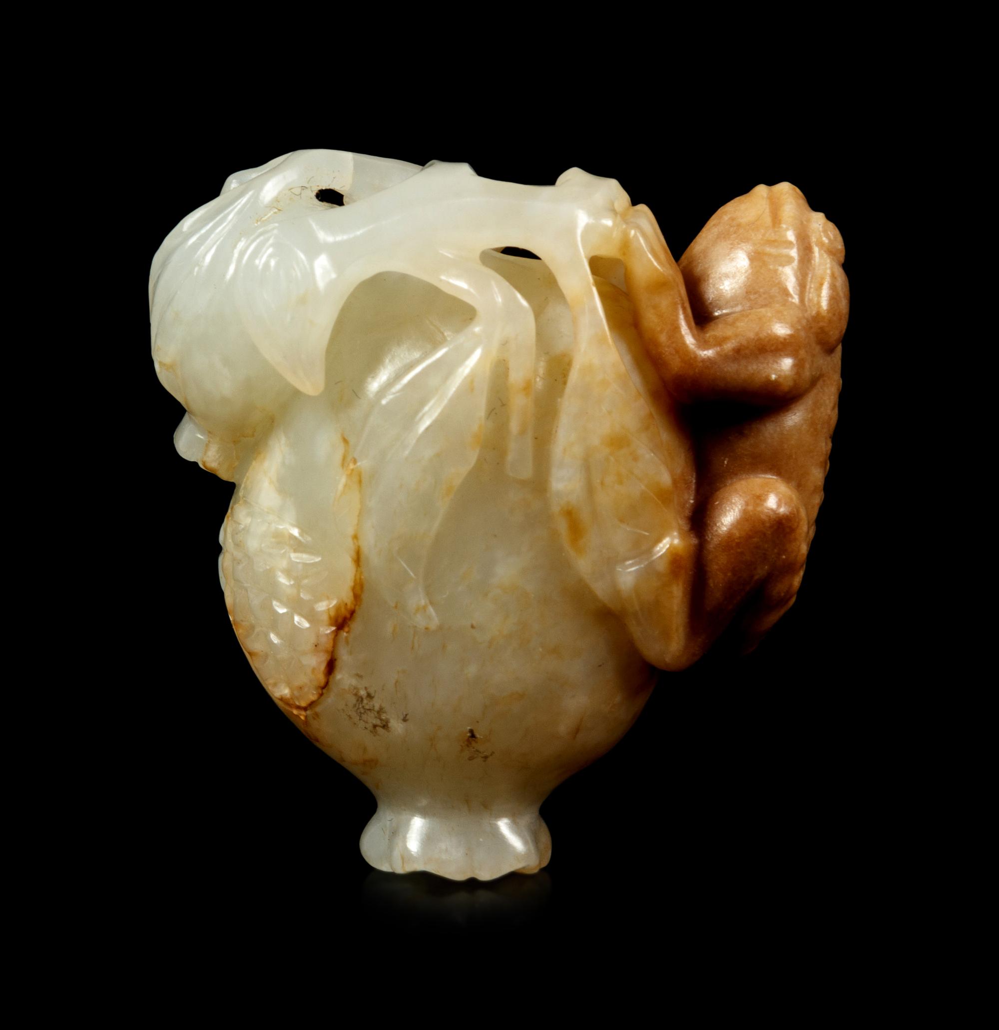 A White and Russet Jade Group of a Frog on a Pomegranate
