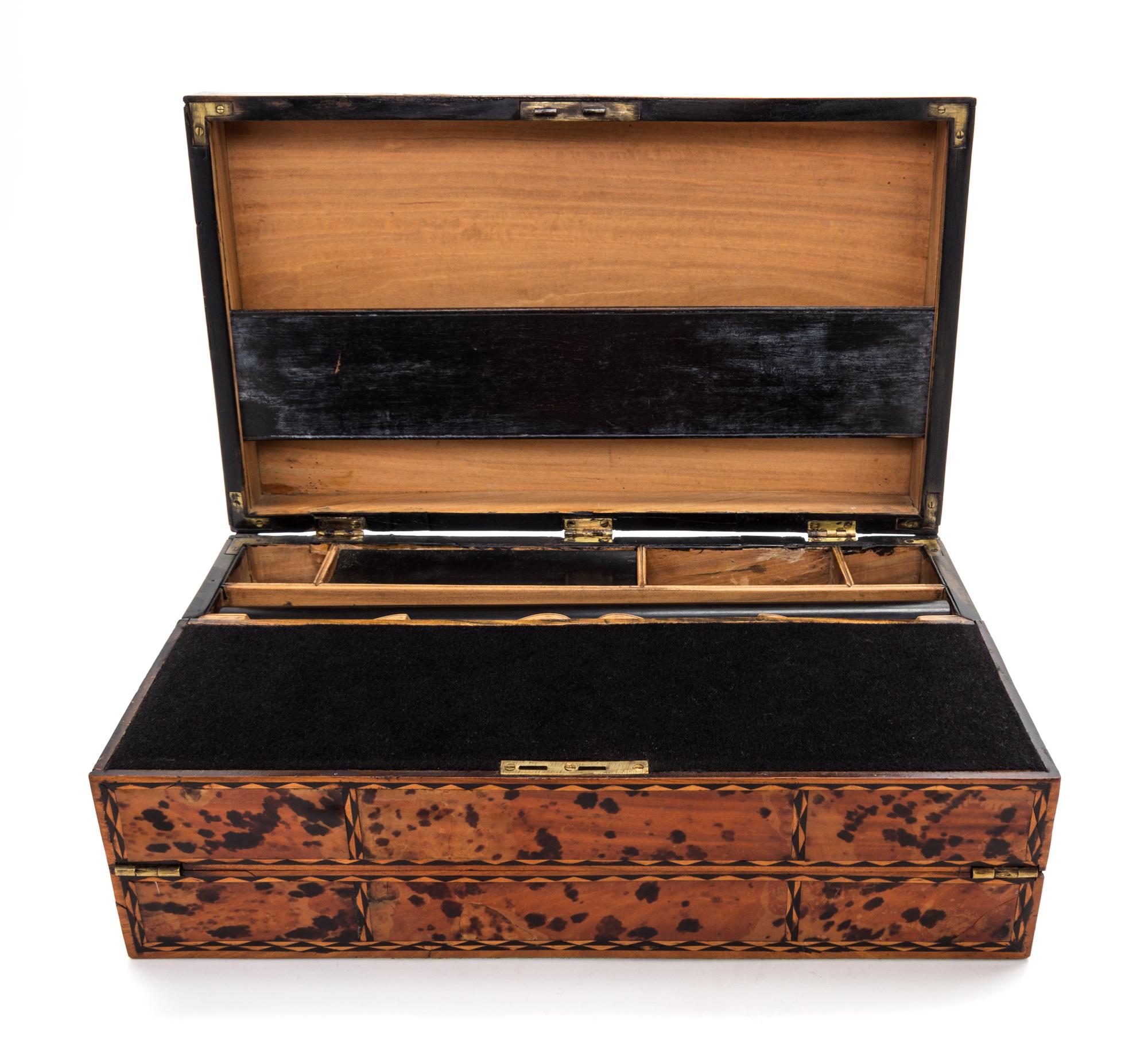 A Tortoise Shell and Parquetry Decorated Writing Slope Height 5 x width 14 3/4 x depth 8 3/4 inches.