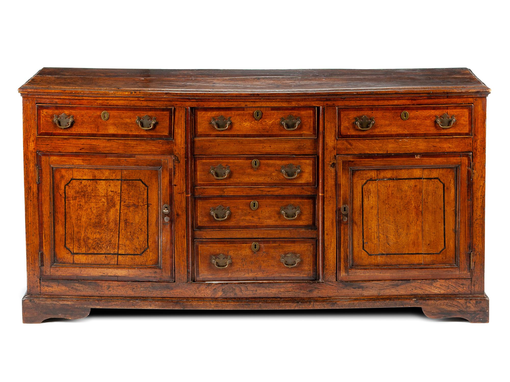 A George III Provincial Parcel Ebonized Sideboard