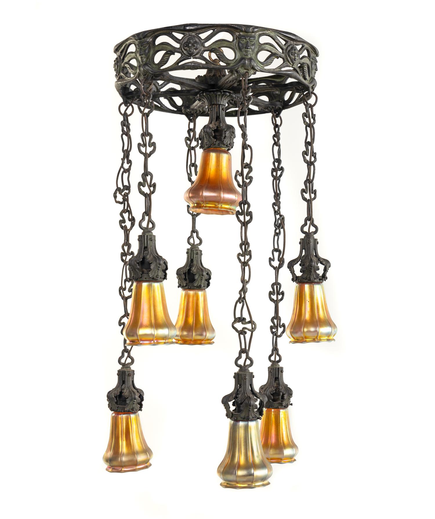 An Art Nouveau Patinated Bronze and Steuben Aurene Glass Seven-Light Ceiling Fixture