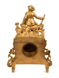A French Gilt Metal Figural Clock — LATE 19TH CENTURY