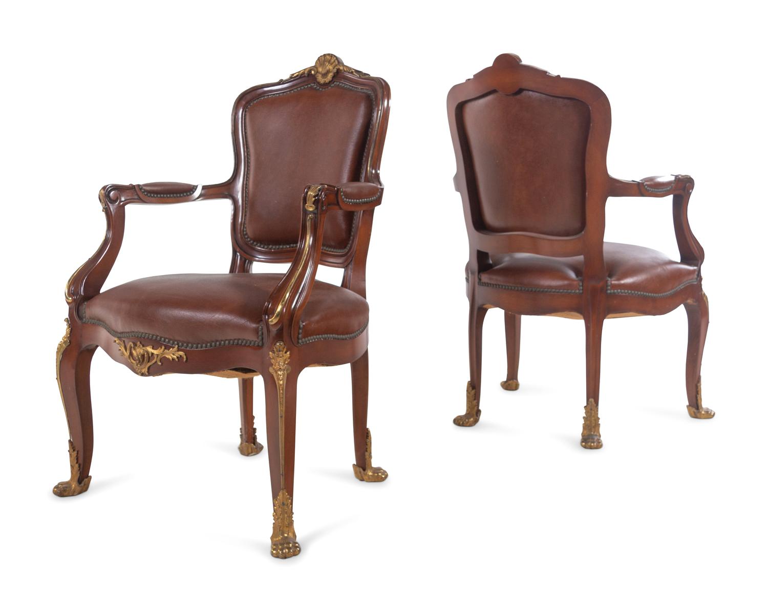 A Set of Fourteen Louis XV Style Gilt Bronze Mounted Walnut Dining Chairs