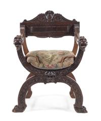 An Italian Walnut Savonarola Chair Height 38 inches. — LATE 19TH CENTURY