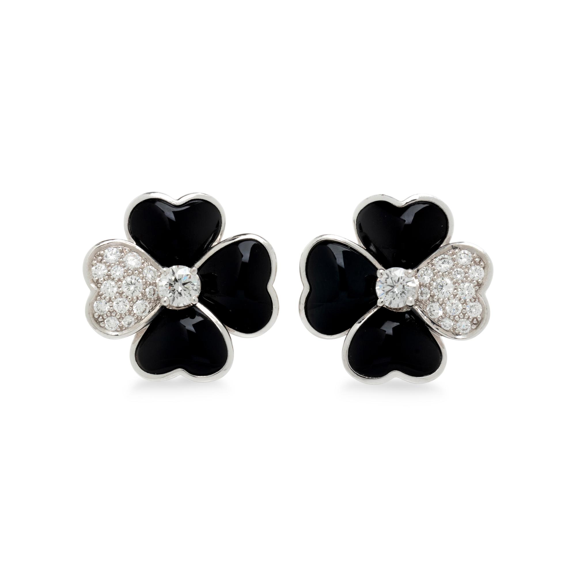 VAN CLEEF & ARPELS, DIAMOND, ONYX, AND WHITE GOLD 'COSMOS' CLIP EARRINGS