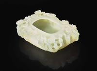 A Chinese carved pale celadon jade "Prunus" brush washer 青白玉梅花筆洗