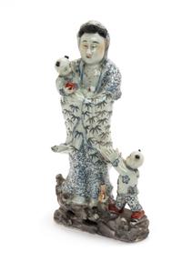 A Chinese Blue, Red and Gilt Enameled Porcelain Figural Group of Guanyin and Two Boys