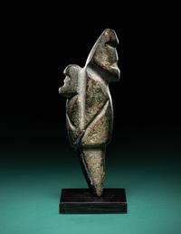 A Mezcala Diorite Standing Figure with an Infant