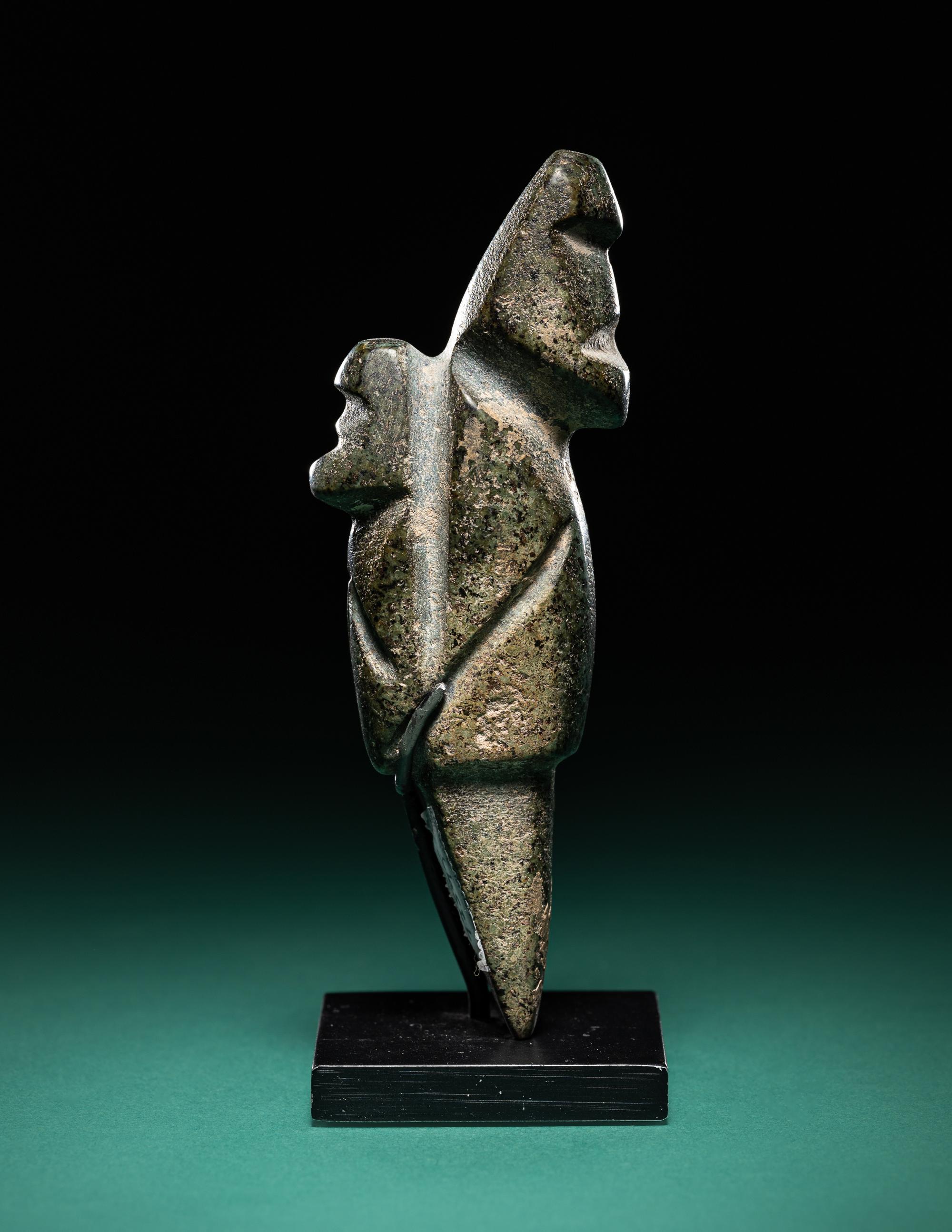 A Mezcala Diorite Standing Figure with an Infant