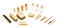 A Victorian 14 Karat Yellow Gold Mounted Dressing Set, Cartier, Paris, Late 19th Century, comprising bottles, brushes, boxes, a shoe ho