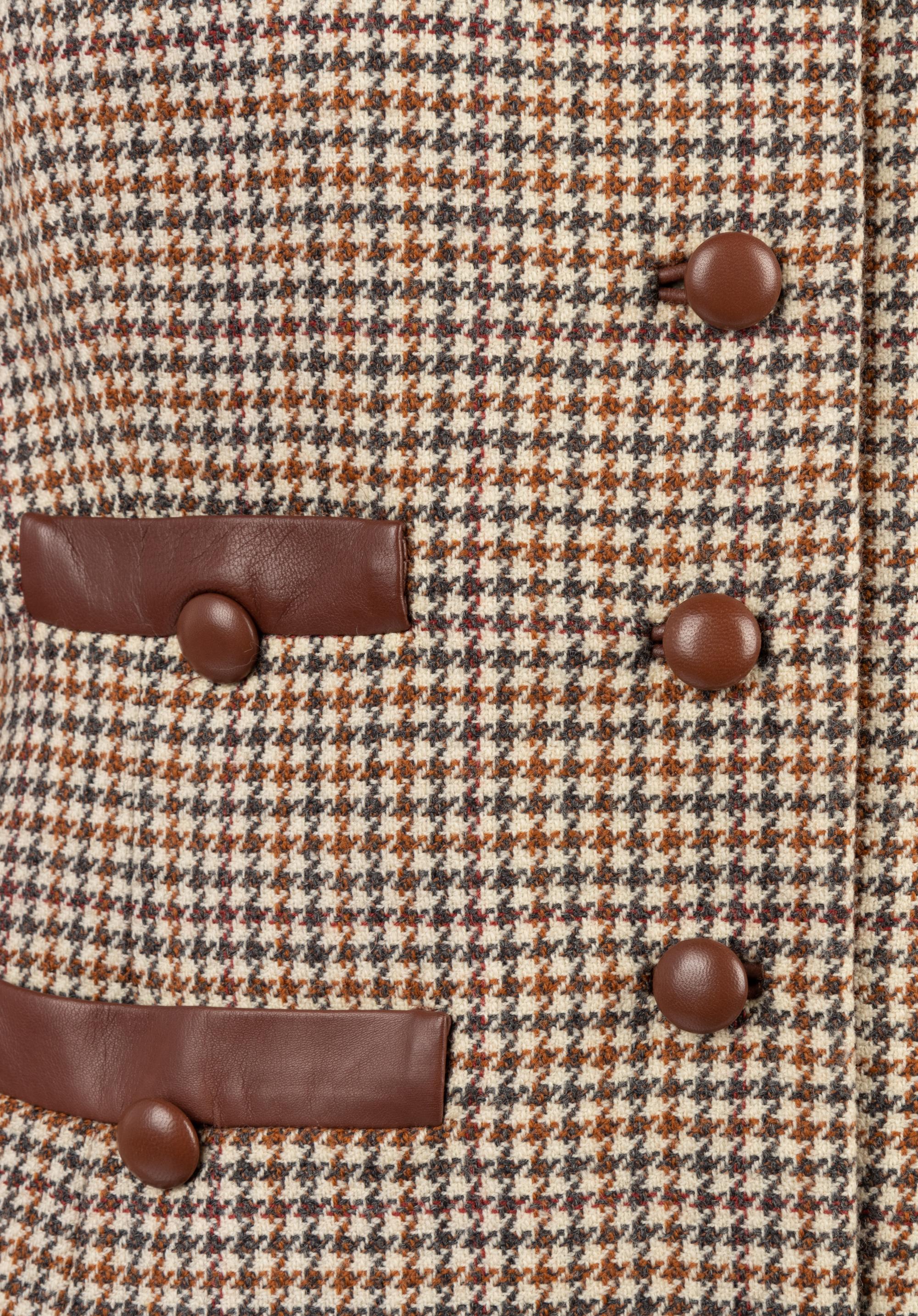 Four Houndstooth Pieces: One Oscar de la Renta Two-Piece Skirt Suit, One Hermes Jacket, One Ralph Lauren Cape