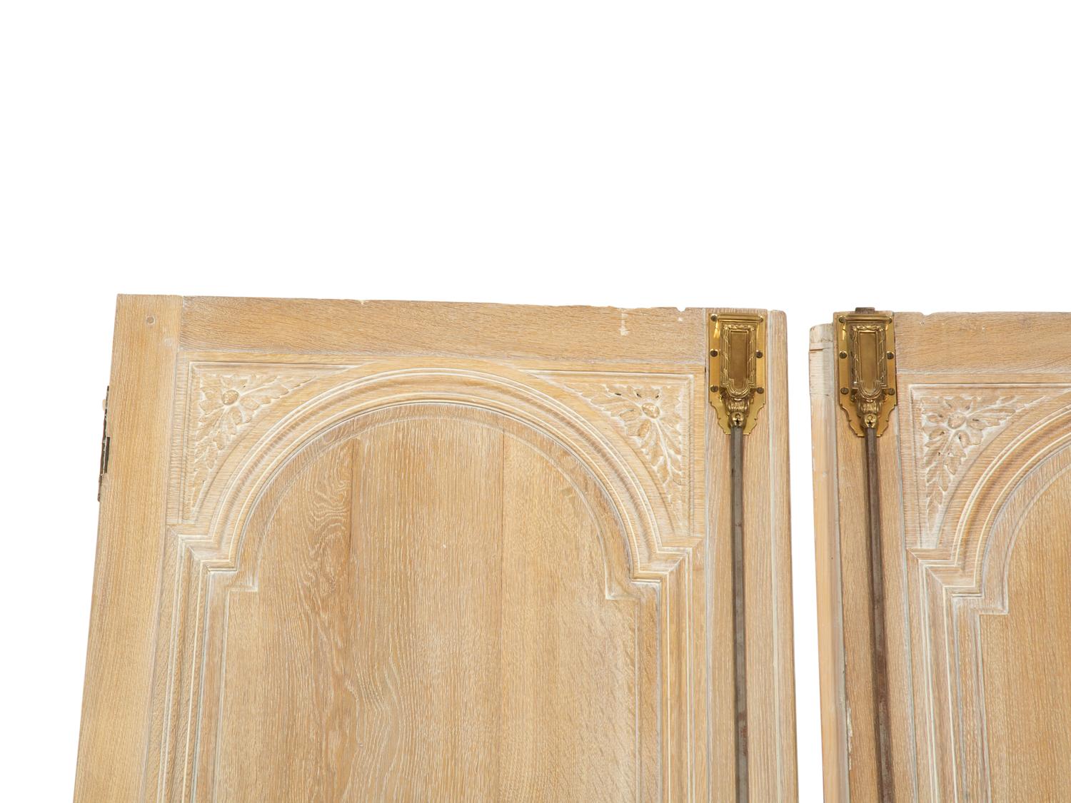 A Pair of French Cerused Oak Doors with Gilt Bronze Fixtures