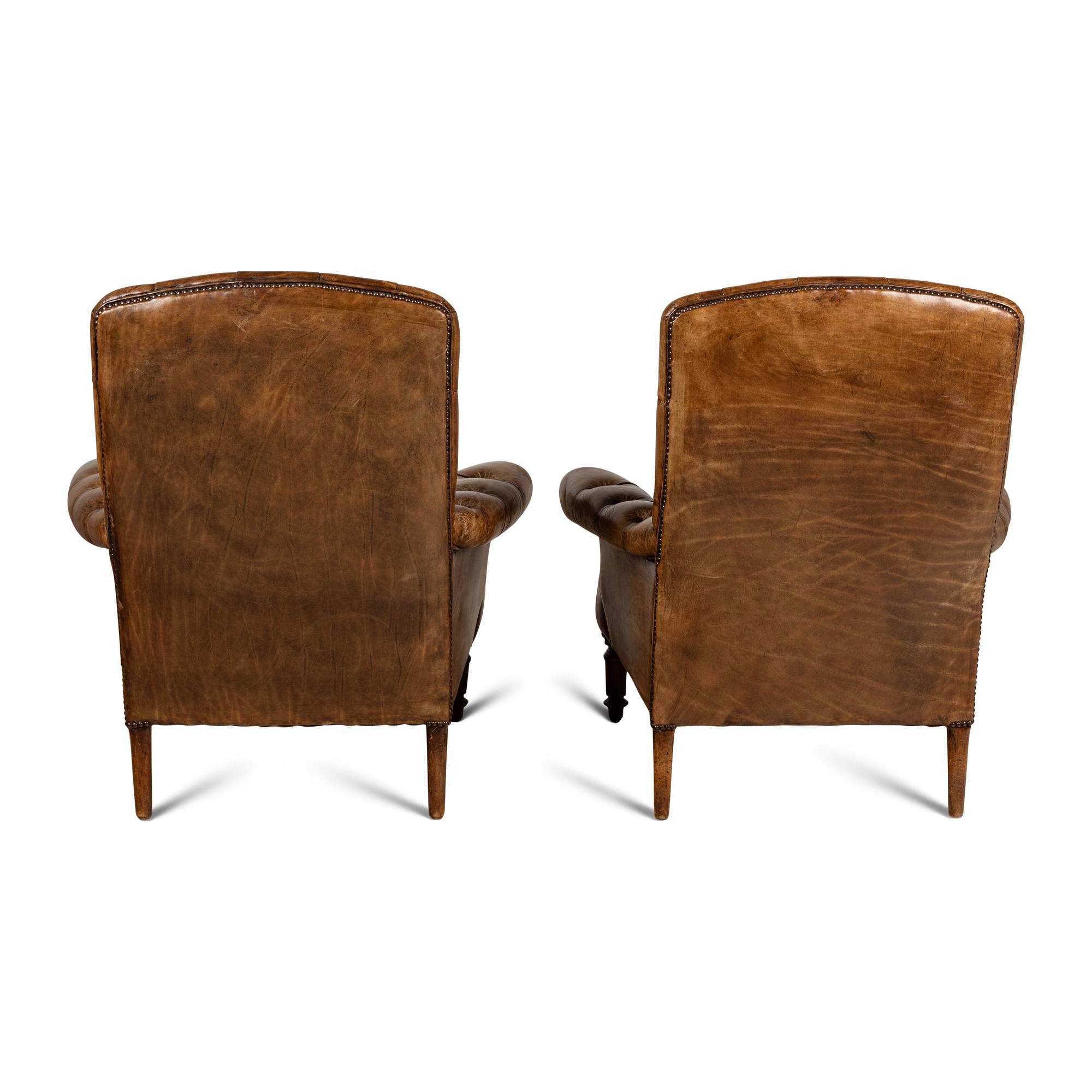 A Pair of English Button-Tufted Leather Armchairs