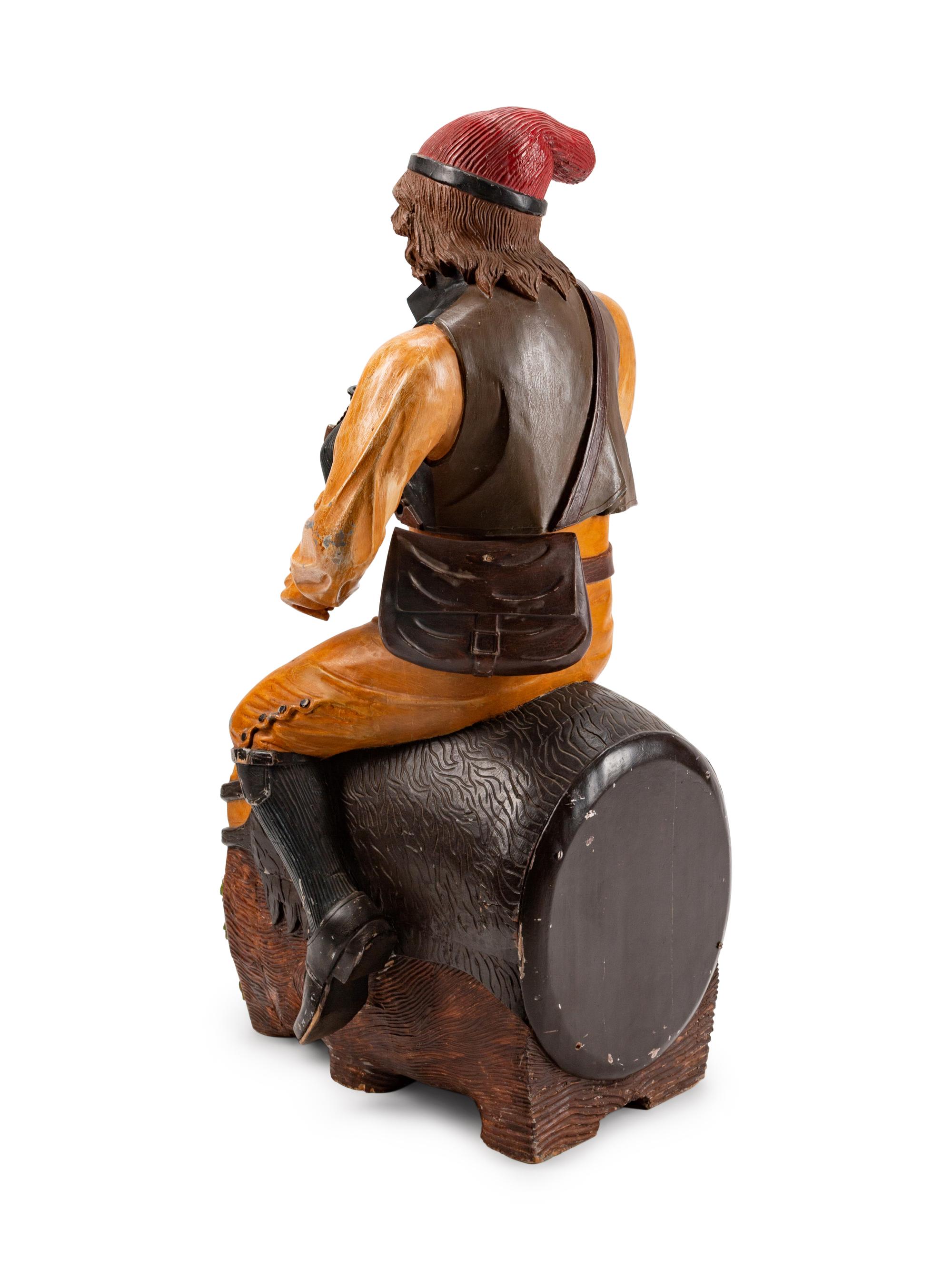 A Dutch Carved and Polychromed Figure of a Man Astride a Wine Barrel