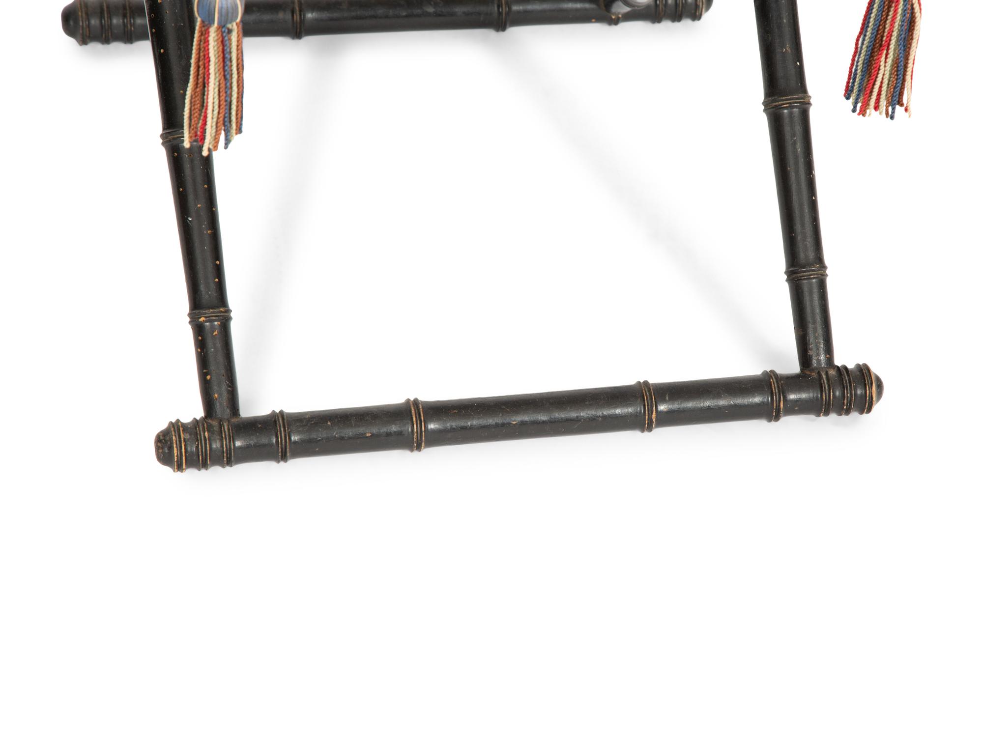 A Pair of Napoleon III Ebonized Folding Chairs with Needlepoint Seats