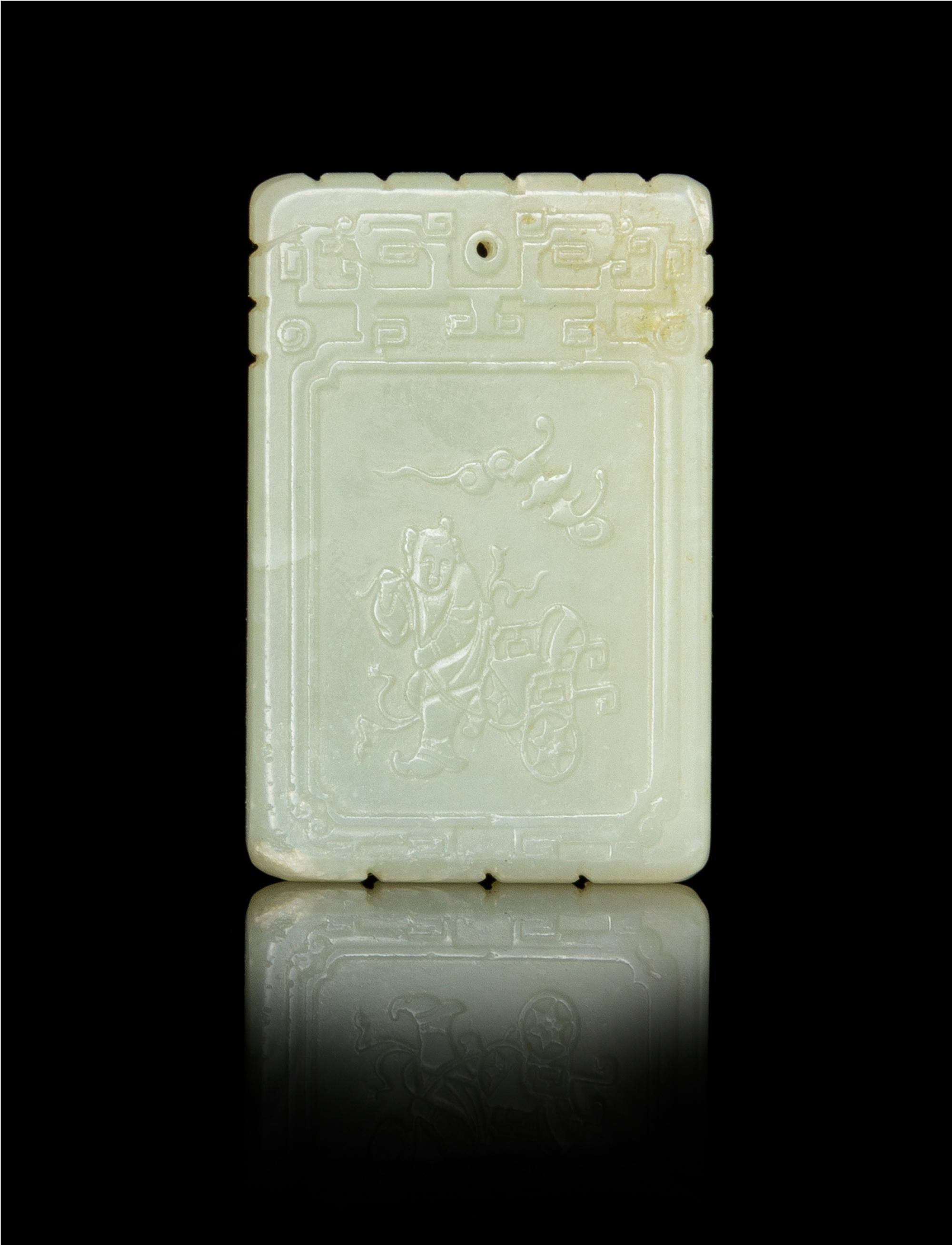 A Carved Near-White Jade Pendant Height of larger 3 1/4 inches.