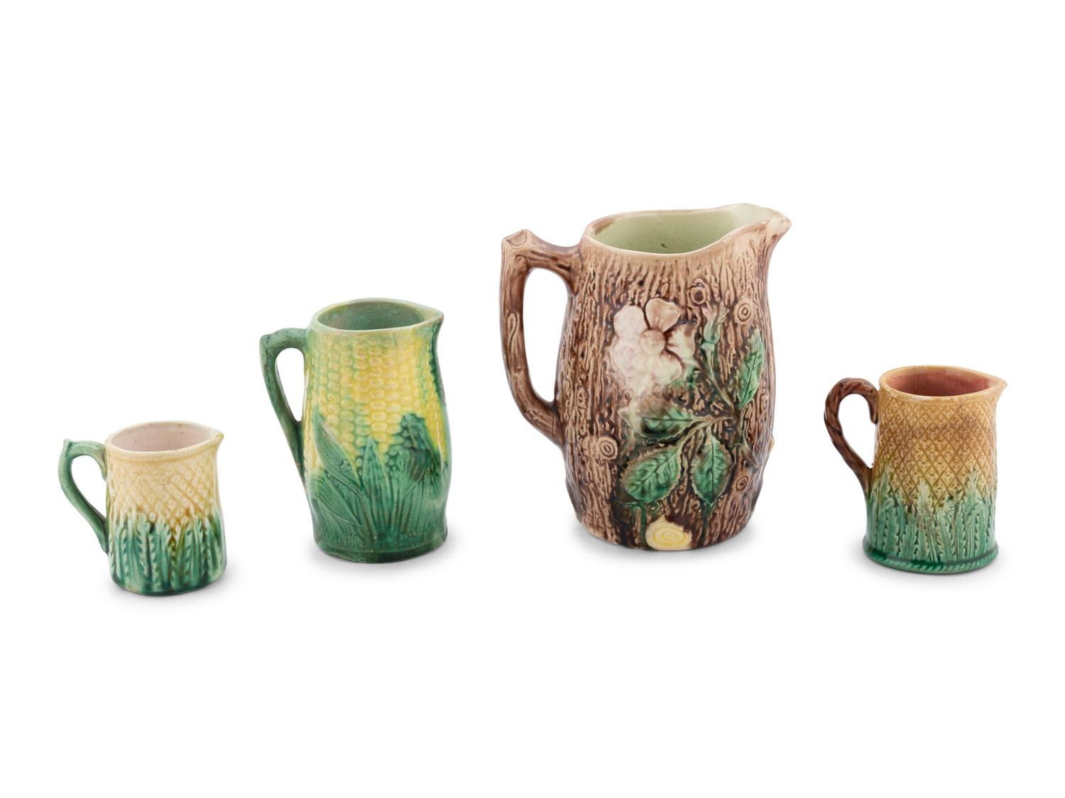 A Group of Nine Majolica Pitchers