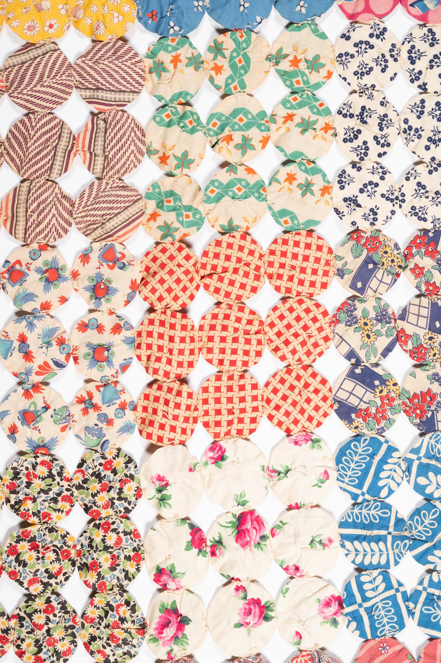 A Pieced Cotton Yo-Yo Quilt