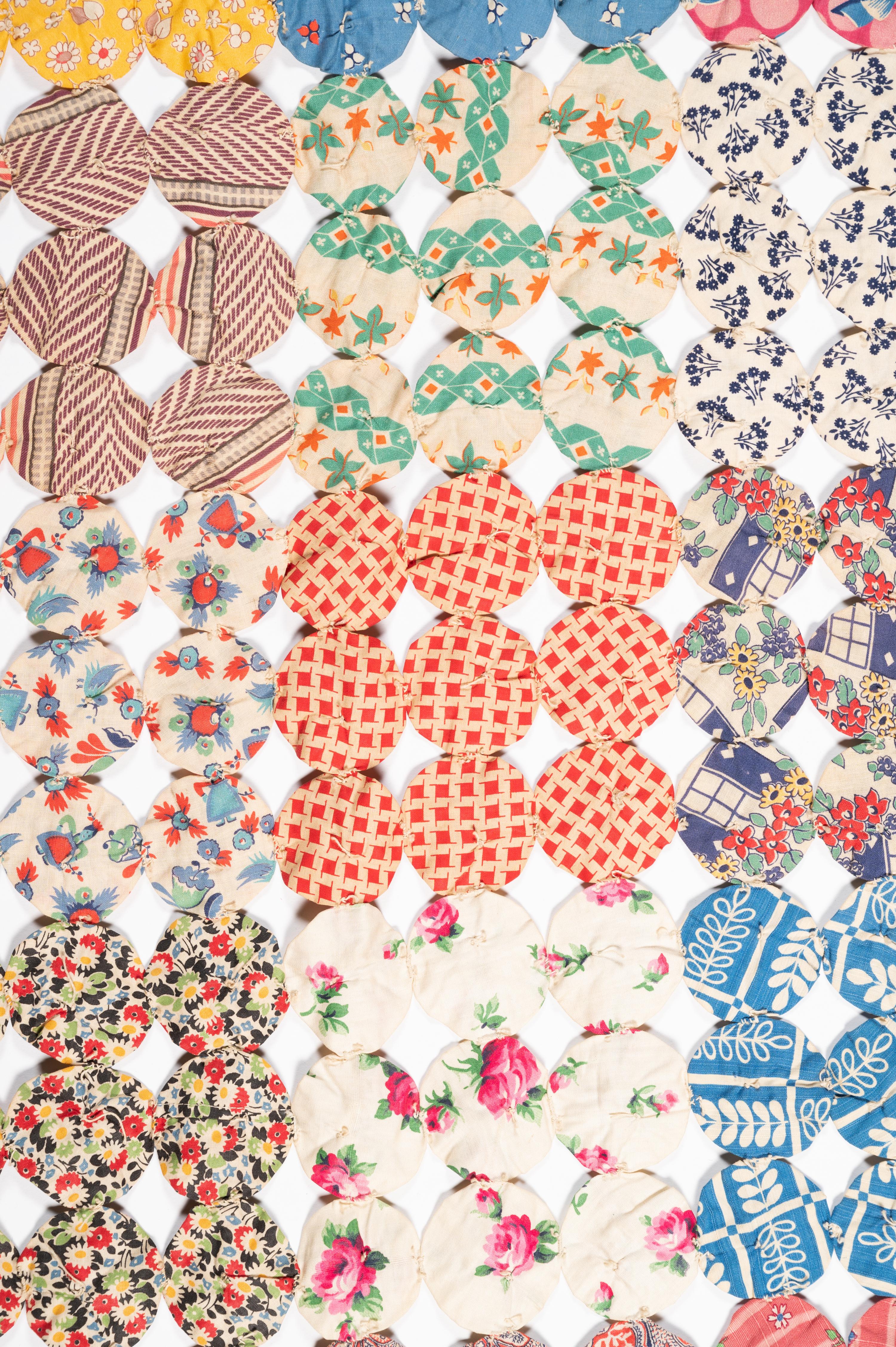 A Pieced Cotton Yo-Yo Quilt