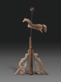 A Primitive Carved Pine and Cast Iron Horse Weathervane on Stand