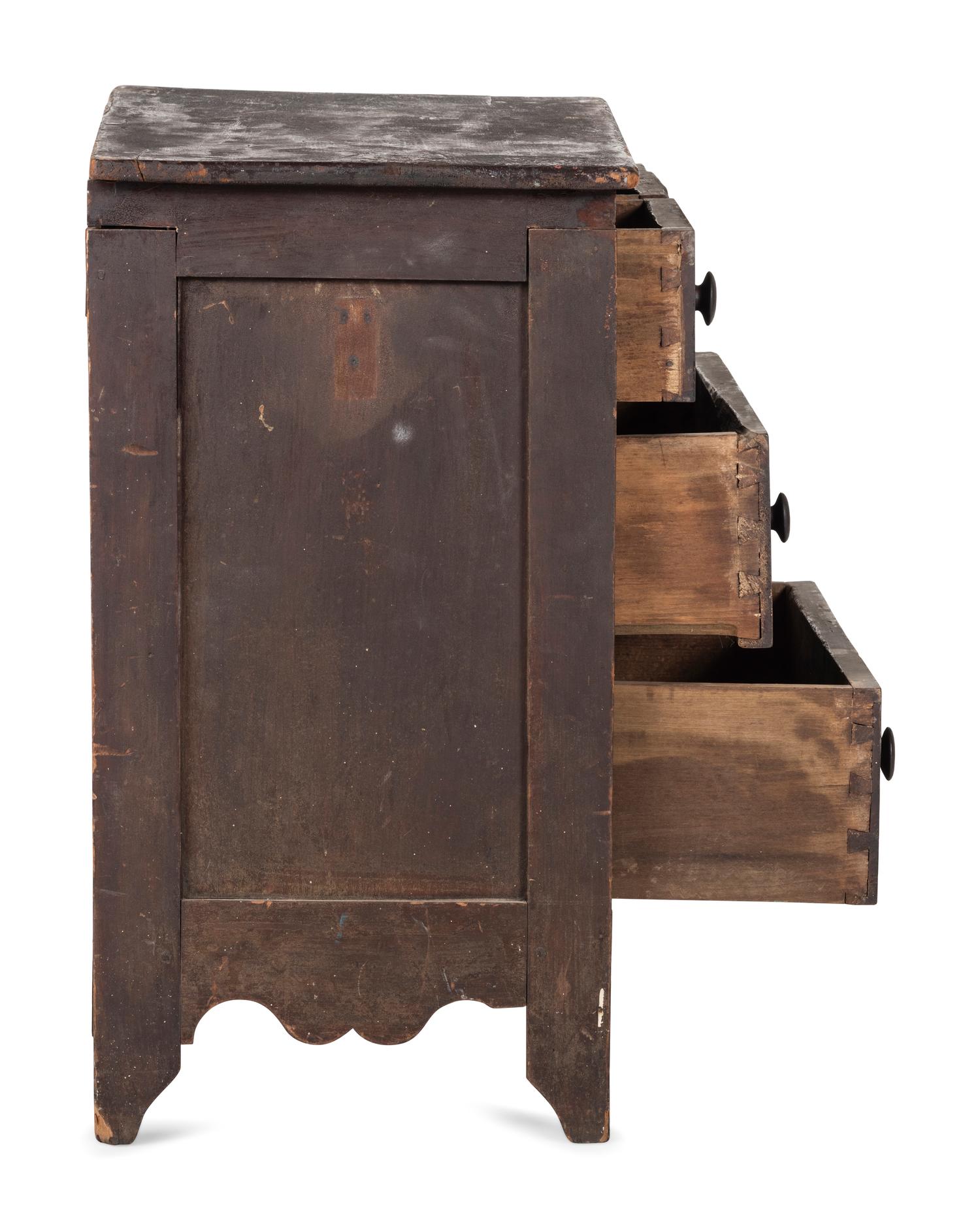 A Classical Black-Painted Cherrywood Diminutive Chest of Drawers