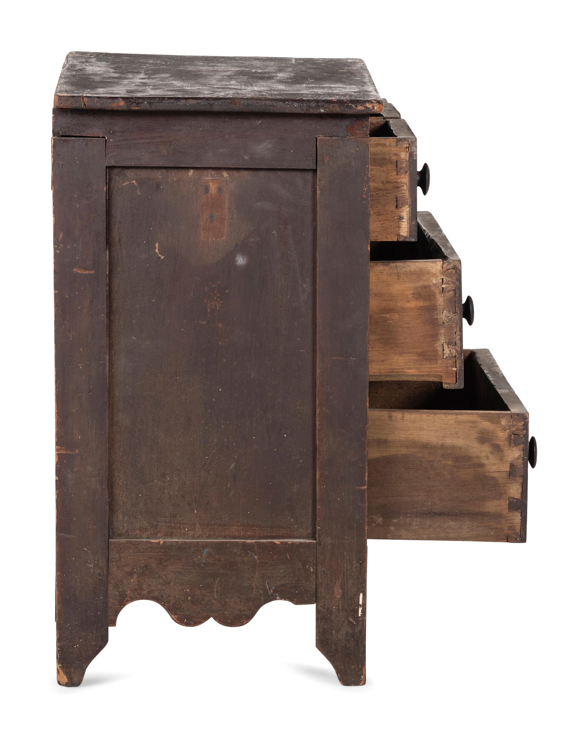 A Classical Black-Painted Cherrywood Diminutive Chest of Drawers