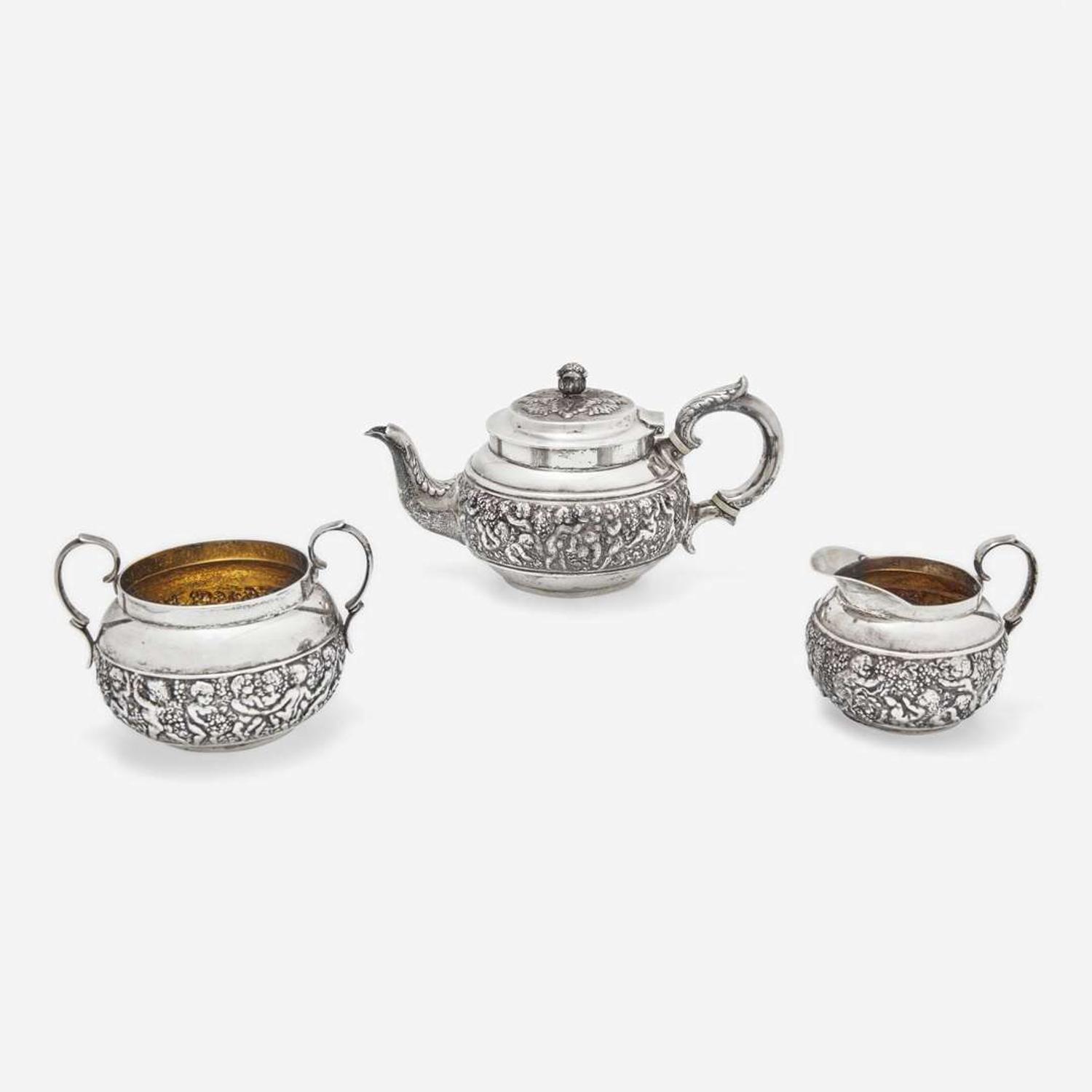A three-piece sterling silver repoussé tea service Tiffany & Co., New York, NY, 1870-1891