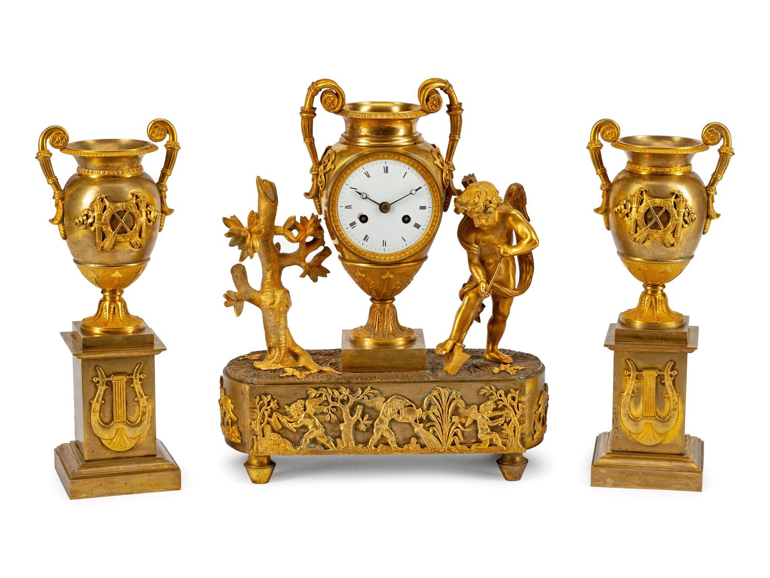 A Louis XVI Style Gilt-Bronze Three-Piece Clock Garniture Late 19th Century