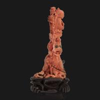 A Chinese carved coral "Dragon, Boy, and Meiren" group