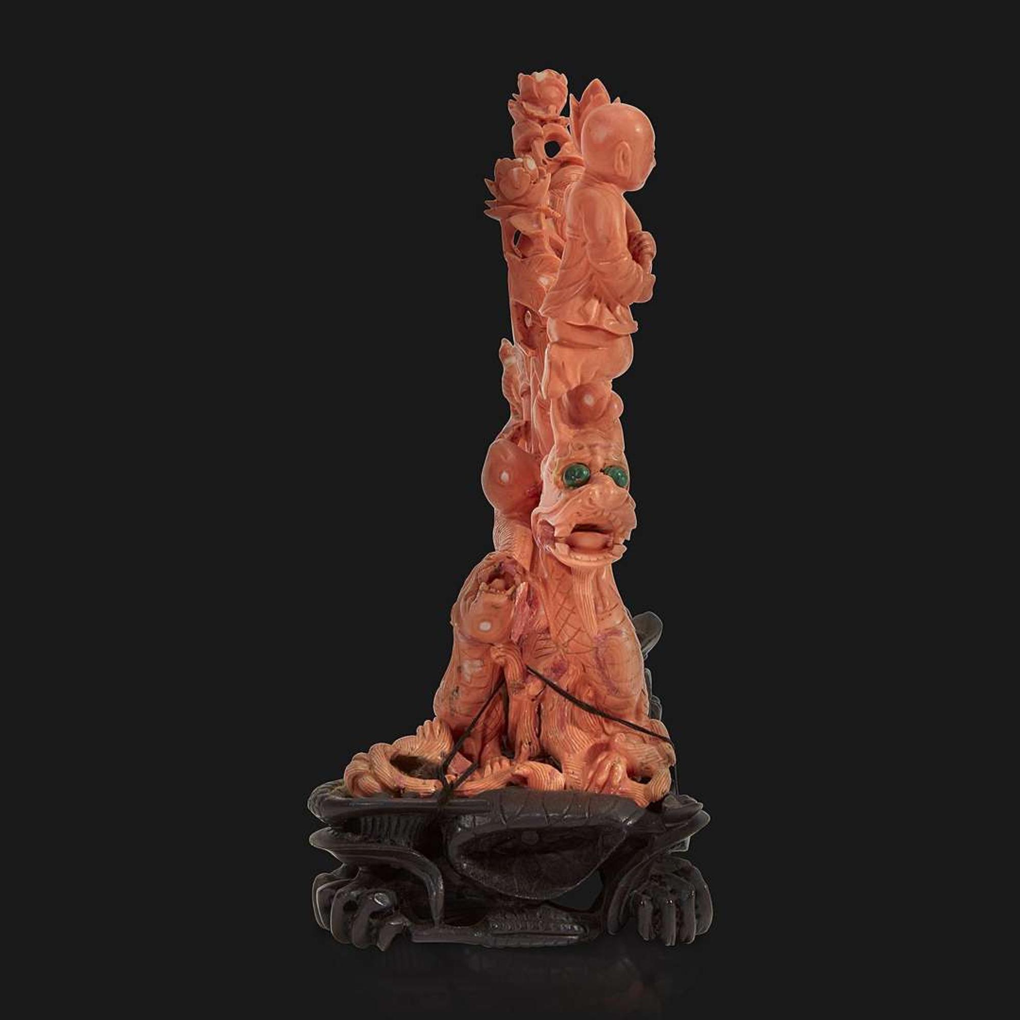 A Chinese carved coral "Dragon, Boy, and Meiren" group