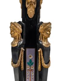 A Pair of Egyptian Revival Gilt Bronze and Porcelain Mounted Ebonized Pedestals