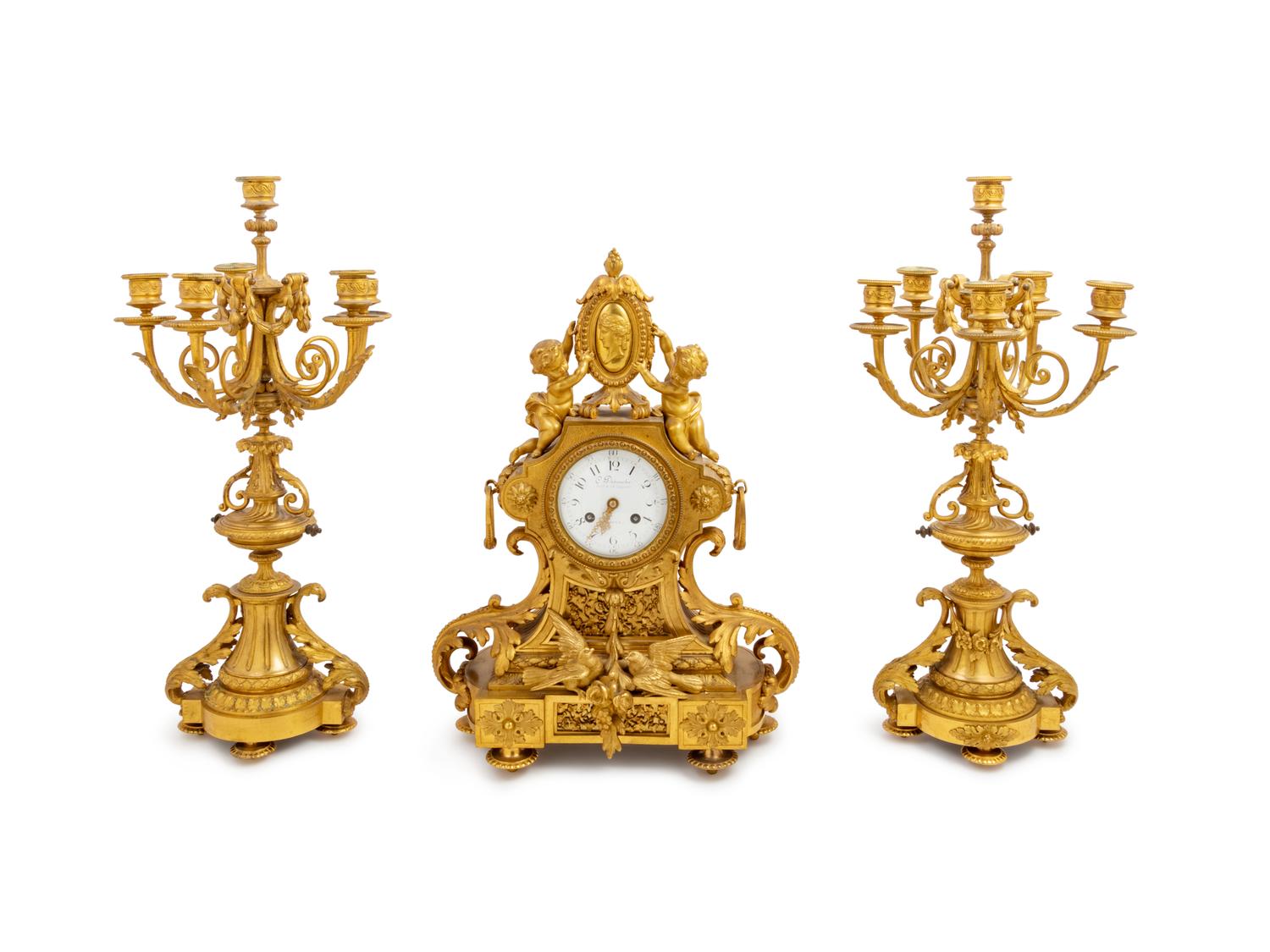 A Louis XVI Style Gilt Bronze Clock Garniture