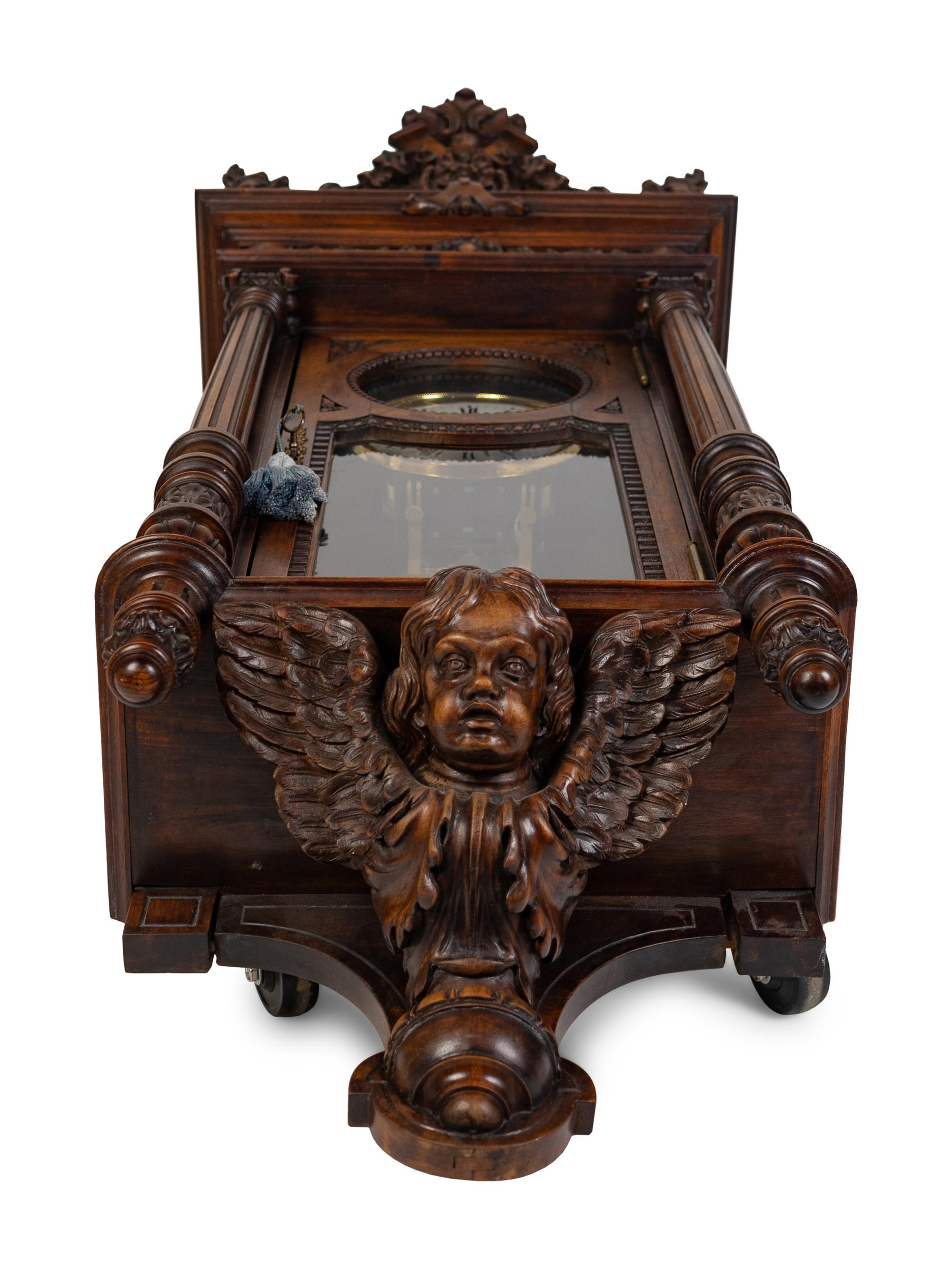 A Renaissance Revival Carved Walnut Regulator Clock