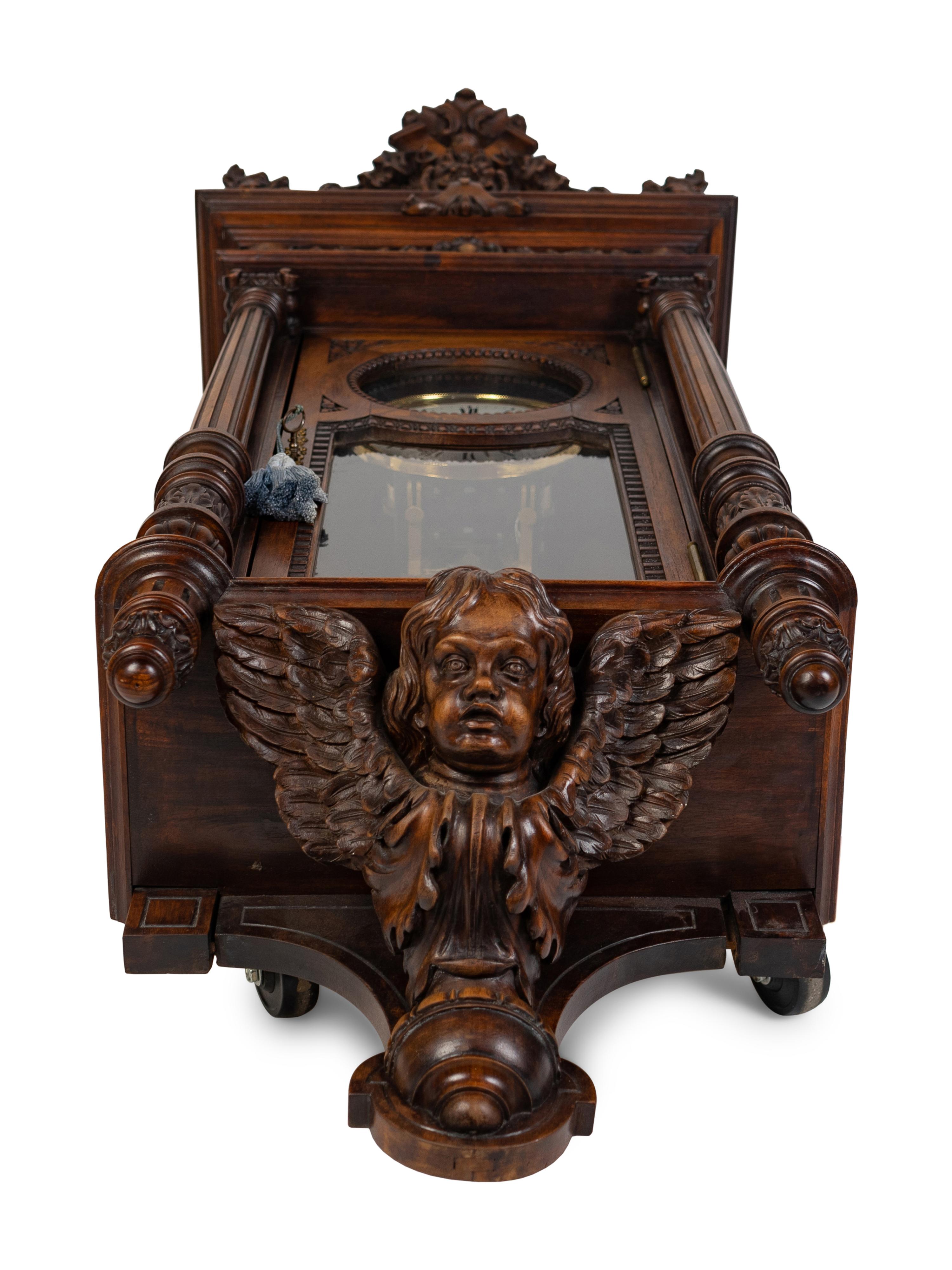 A Renaissance Revival Carved Walnut Regulator Clock