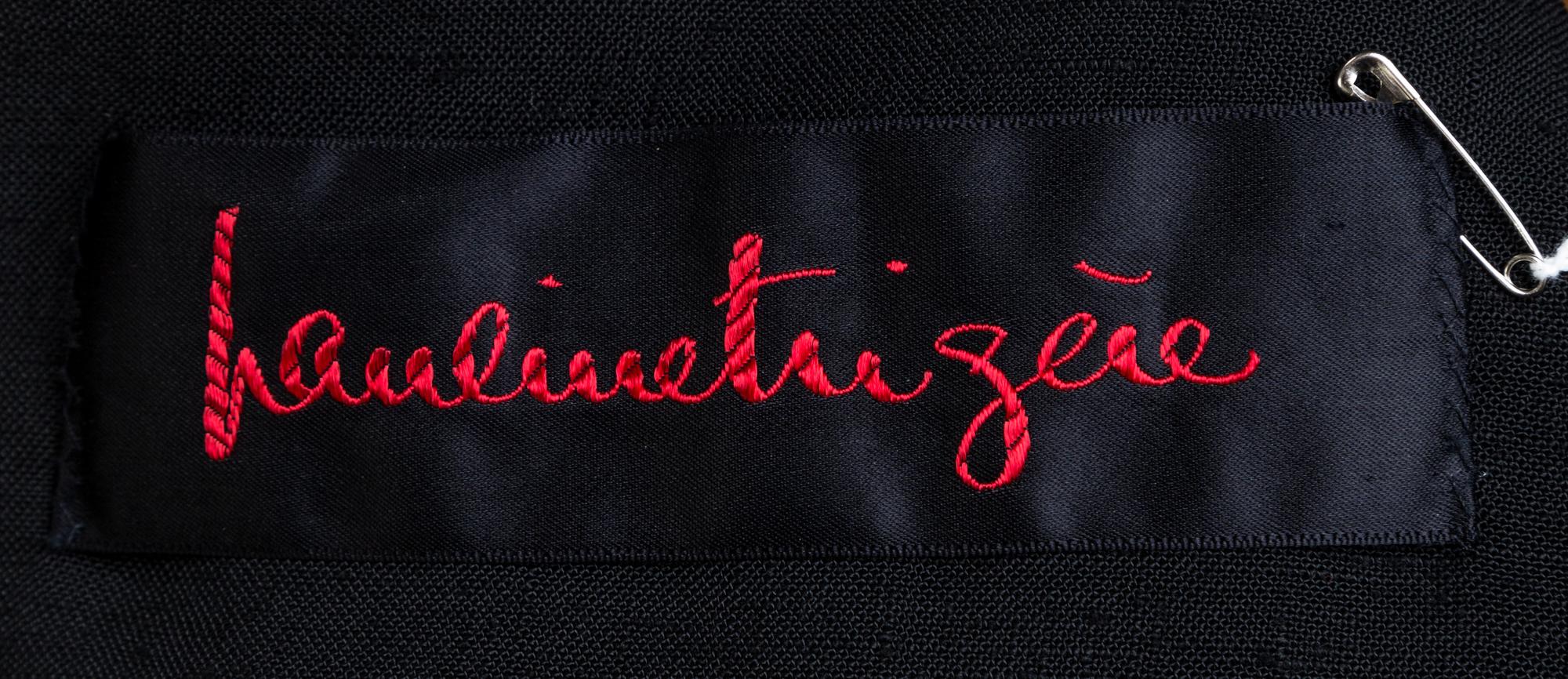 A Pauline Trigere Black Sleeveless Vest and Skirt Set, No size.