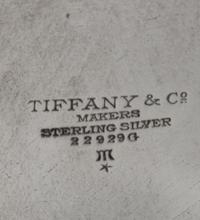 An American Silver Dish, Tiffany & Co., New York, NY, First half 20th century, having scalloped edges with foliate and berry engraving.