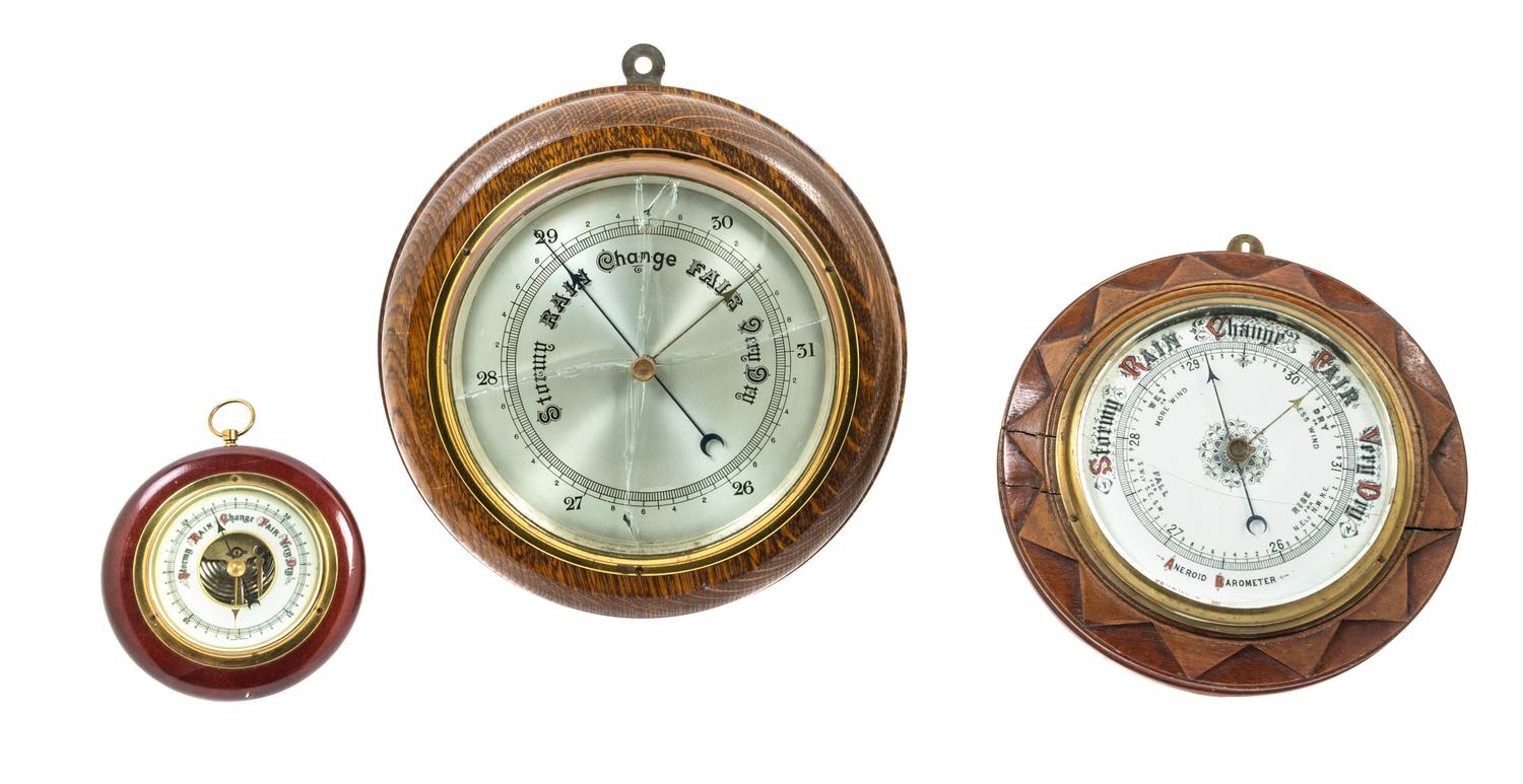 A Group of Three Aneriod Barometers Diameter of largest 12 inches.