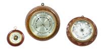 A Group of Three Aneriod Barometers Diameter of largest 12 inches.