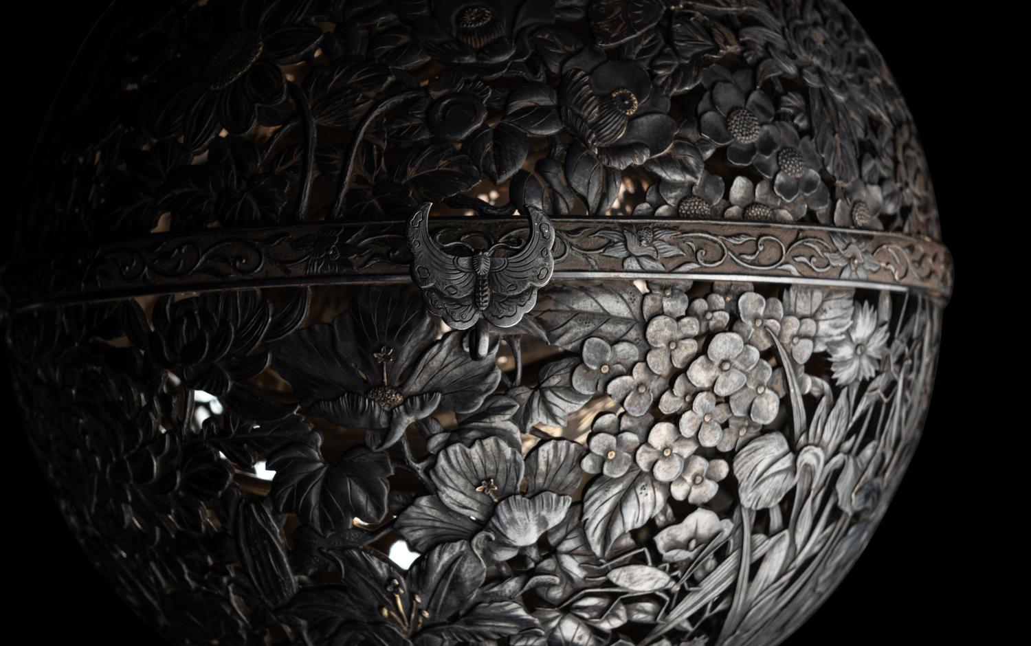 A Japanese Silver and Parcel Gilt Hanging Incense Ball