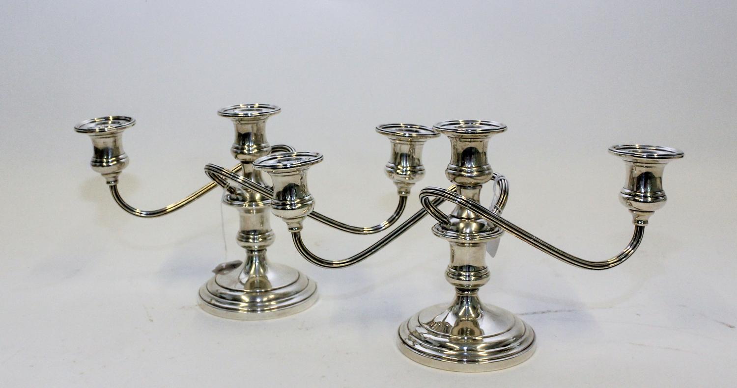 A Pair of American Silver Three-Light Candelabra, S. Kirk & Son, Baltimore, MD, having a central urn form cup issuing two twist arms wi