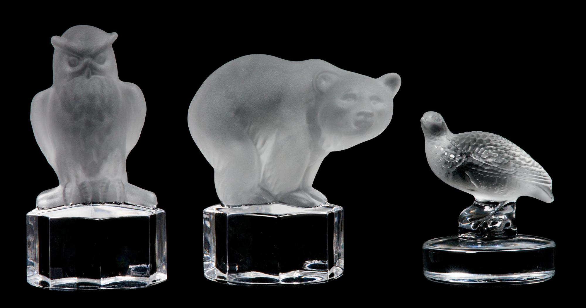 A Lalique Molded and Frosted Glass Paperweight Height of first 2 5/8 inches.