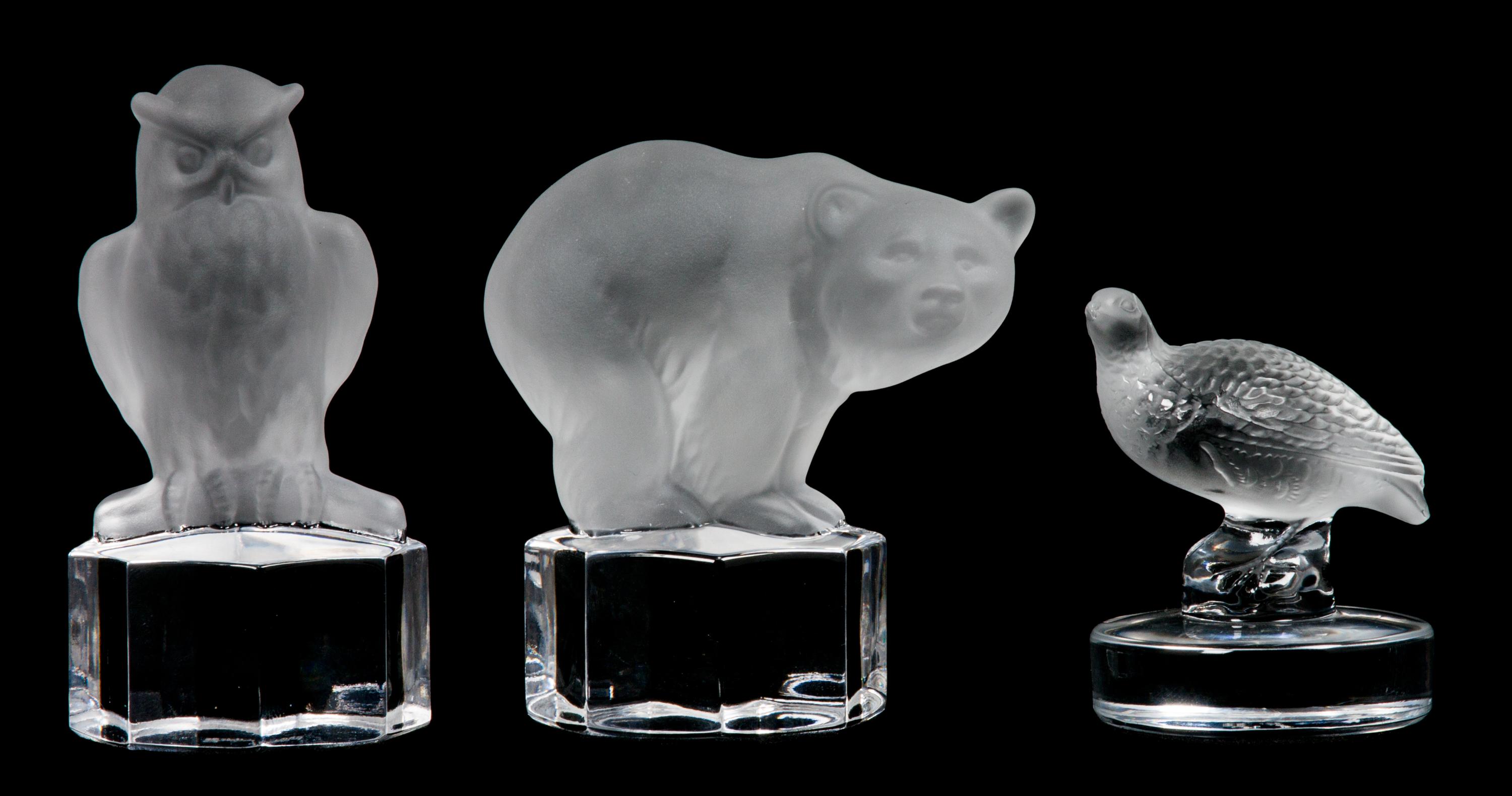 A Lalique Molded and Frosted Glass Paperweight Height of first 2 5/8 inches.