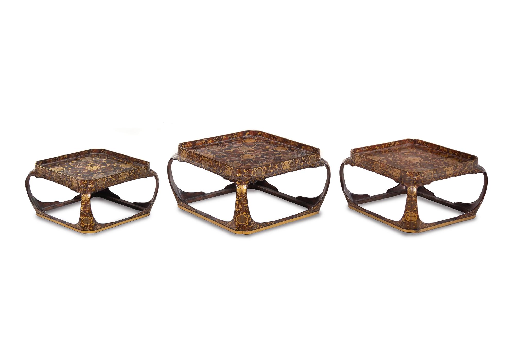 A Set of Three Japanese Gilt Decorated Lacquer Nesting Tables