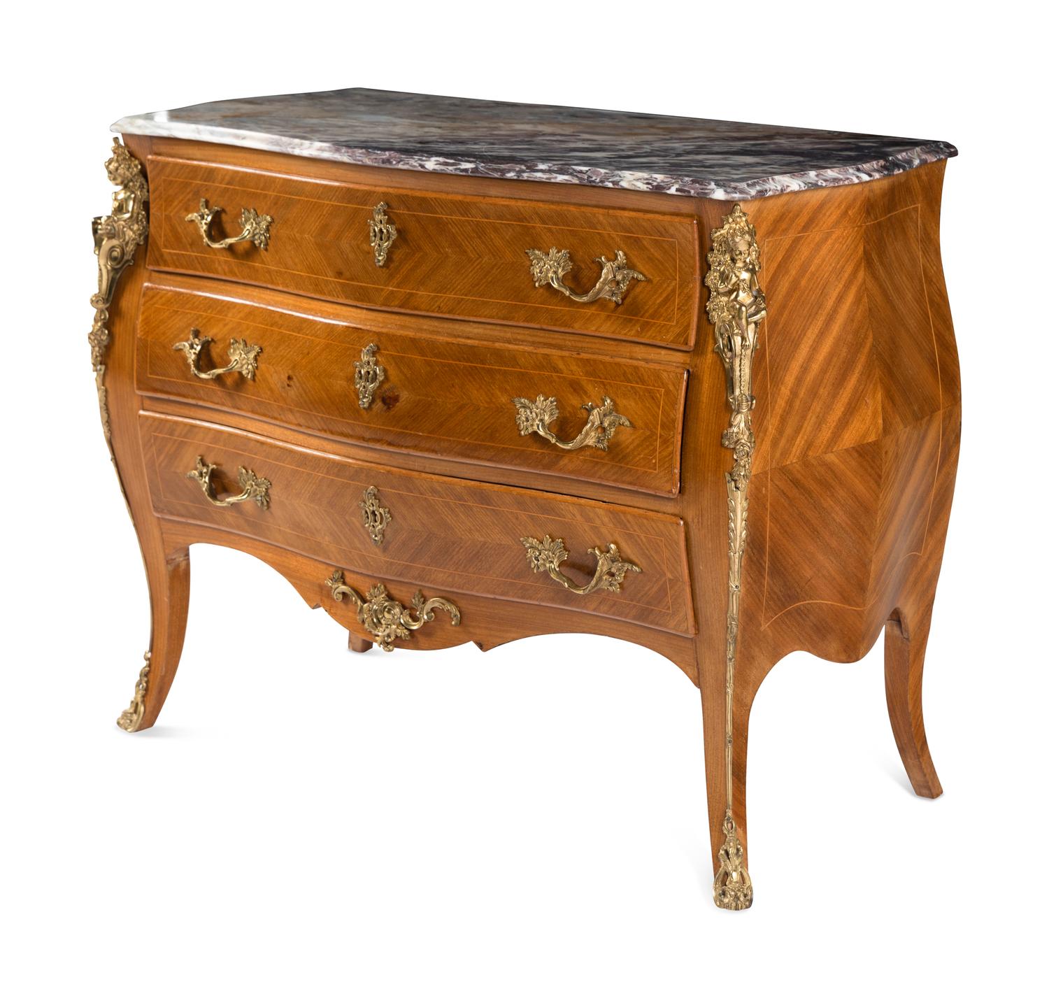 A Régence Style Gilt Metal Mounted Marble-Top Commode