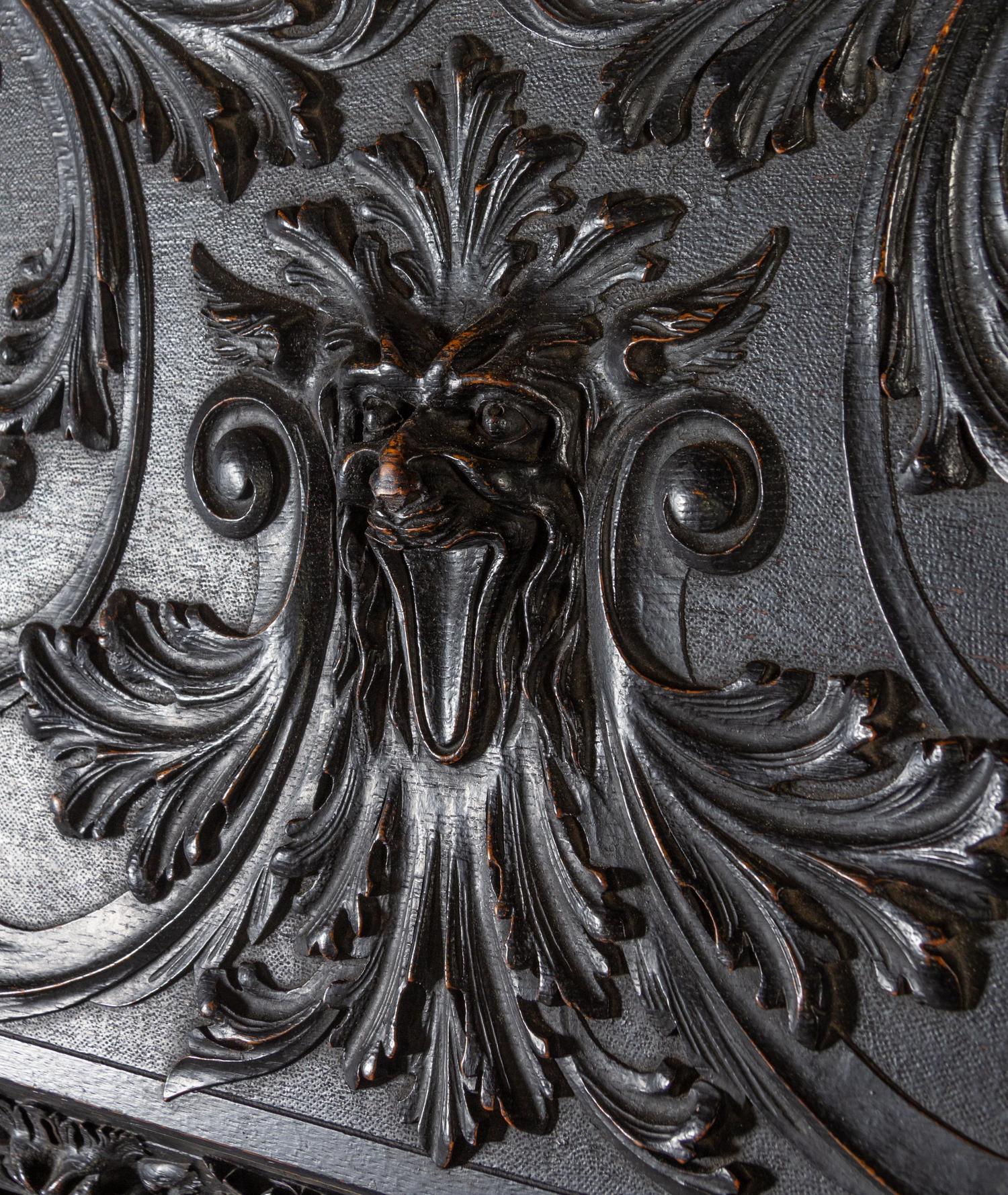 A Renaissance Revival Carved Slant-Front Desk