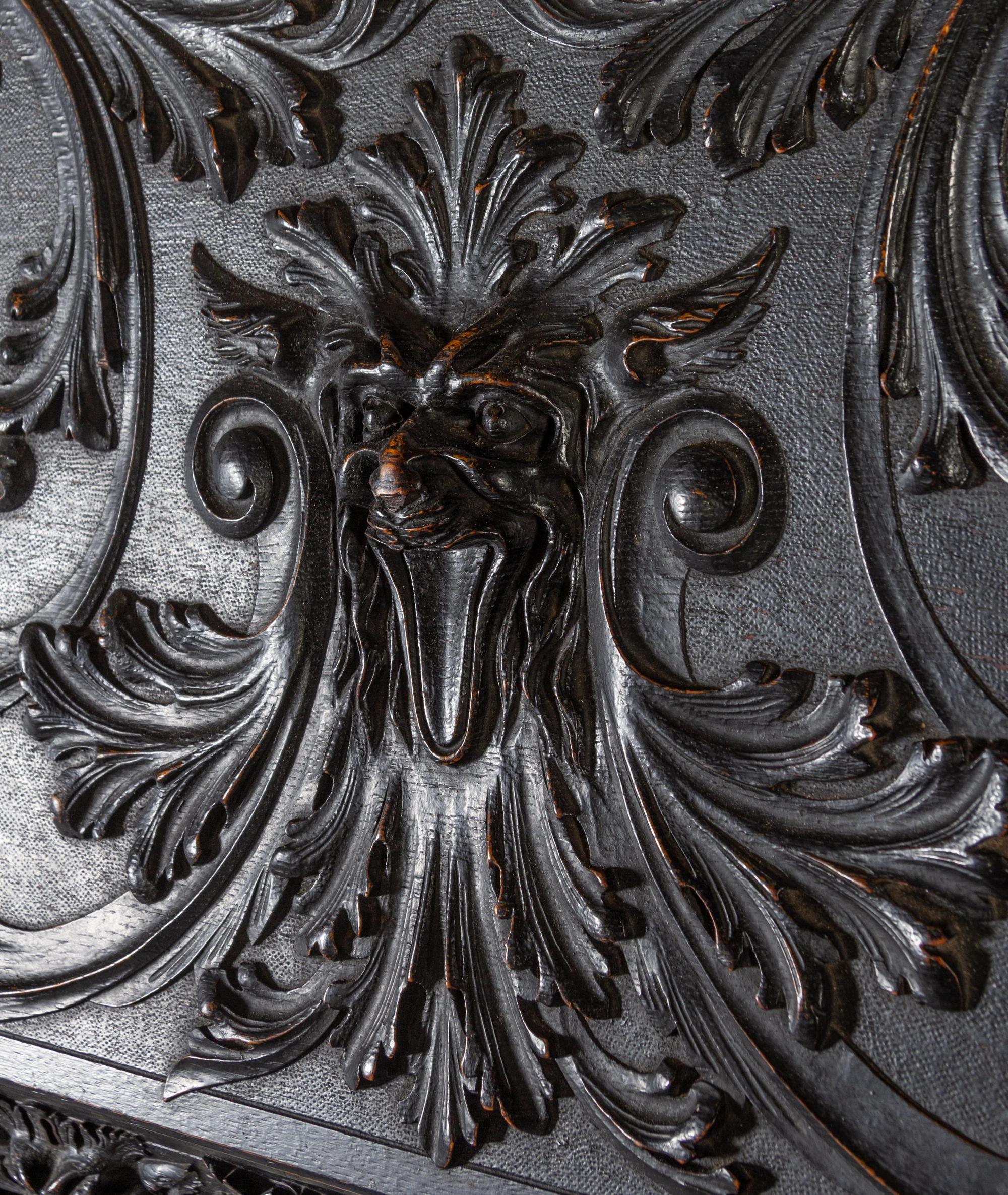 A Renaissance Revival Carved Slant-Front Desk