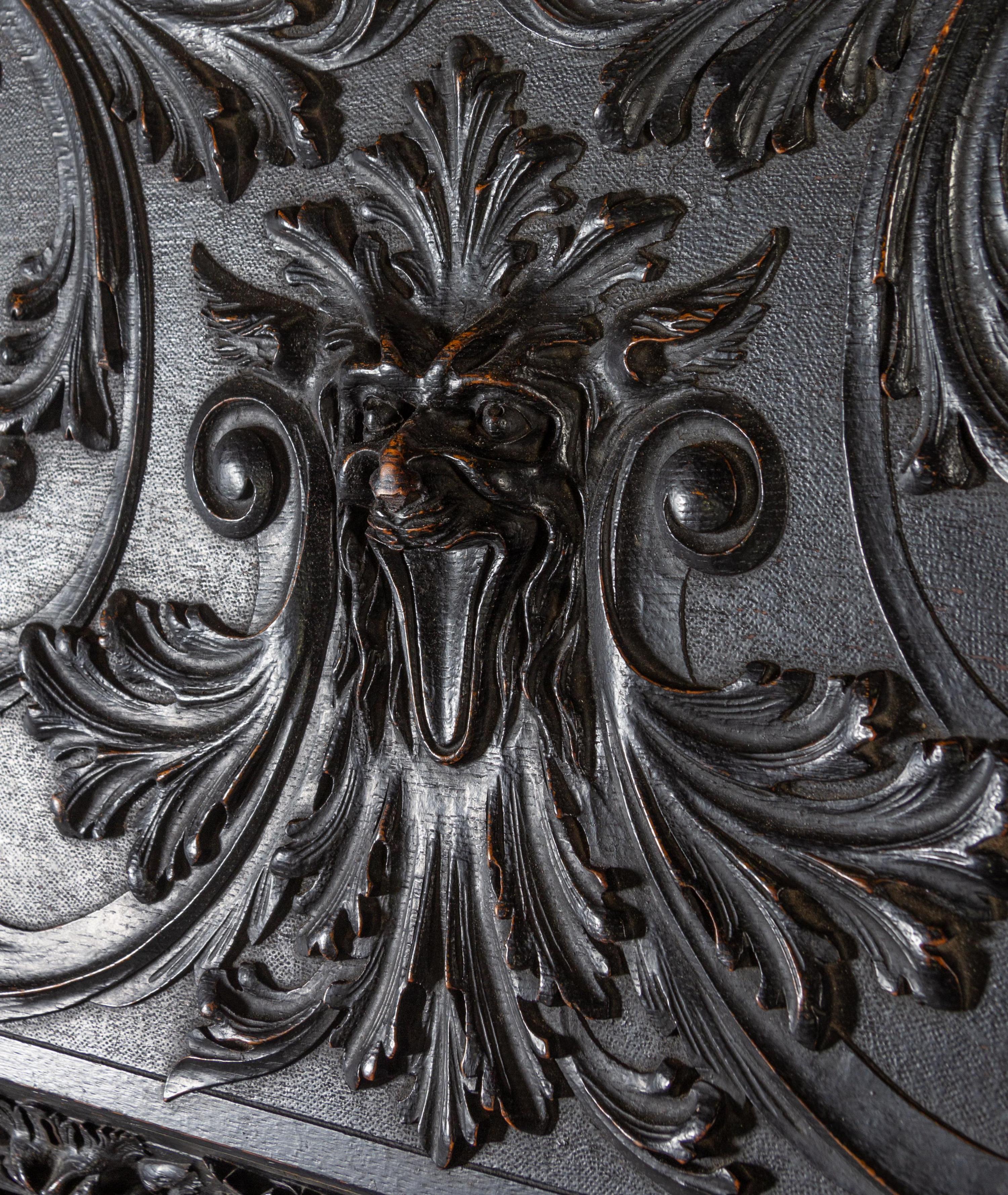 A Renaissance Revival Carved Slant-Front Desk